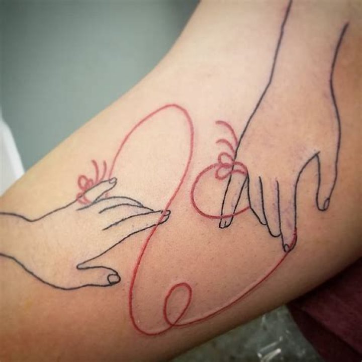 What does the red string tattoo mean?